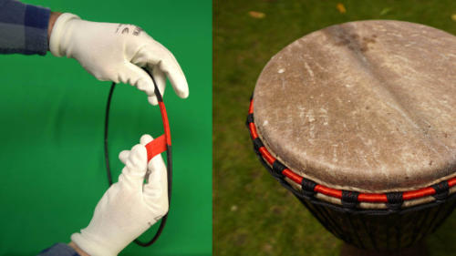 Making a djembe crown with cloth strips and rope around the metal ring